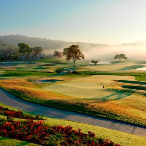 Morning fog lifting of the course